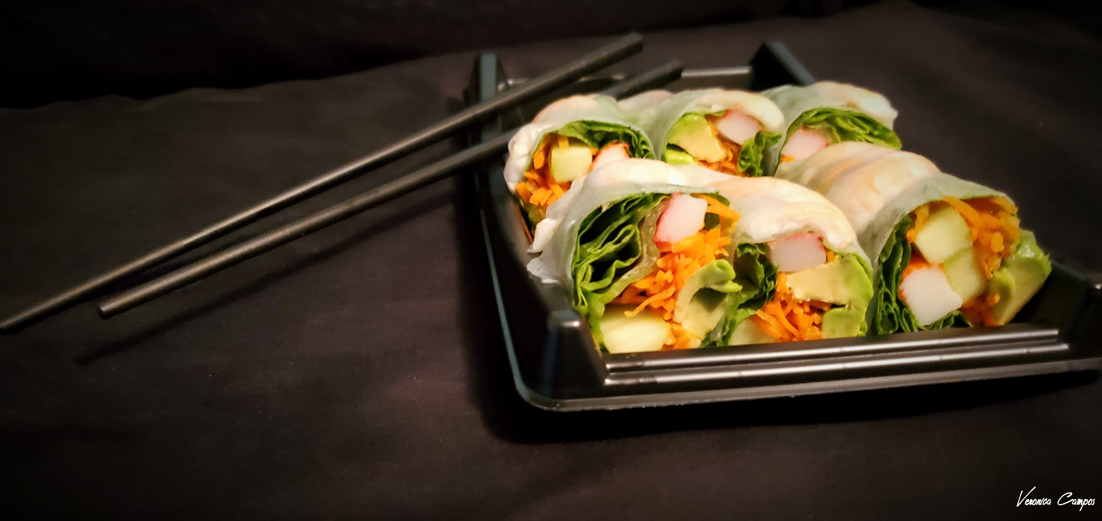 Spring rolls with chopsticks.Photo taken by me.